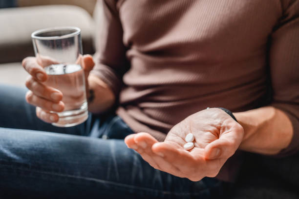 NMN ingredient dosage - a man taking his medication